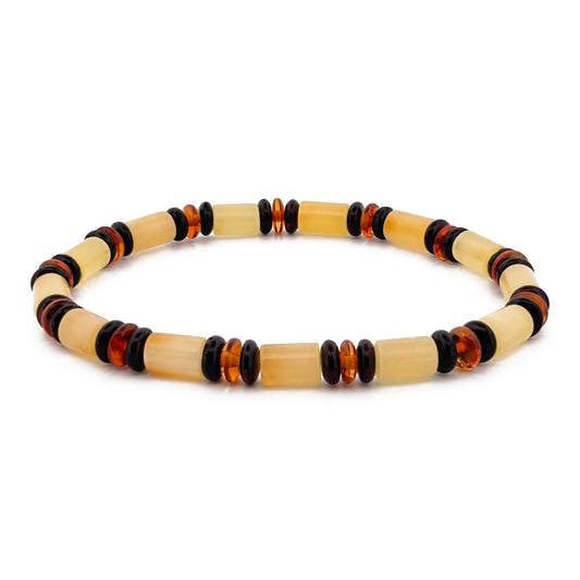 CYLINDRE, natūralaus gintaro apyrankė.  Poliruotos, cilindro formos, natūralaus gintaro detalės su intarpais.  Detalių diametras:  5 x 8 mm. Vidinis Ilgis: 16 – 21 cm. Suverta ant elastingos, silikoninės gumos. Be užsegimo.