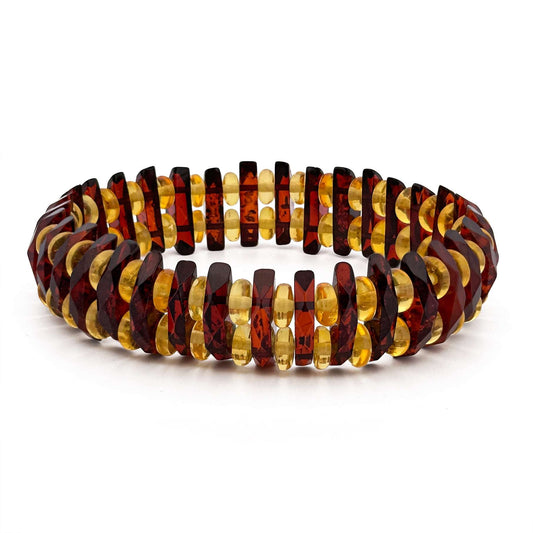 MANDARIN, natūralaus gintaro apyrankė.   Poliruotos, natūralios gintaro detalės.  apyrankės plotis - 17mm;  plotis 6mm.   Vidinis Ilgis: 16 – 21 cm.  Suverta su dviguba elastinga, silikonine guma.  Be užsegimo.