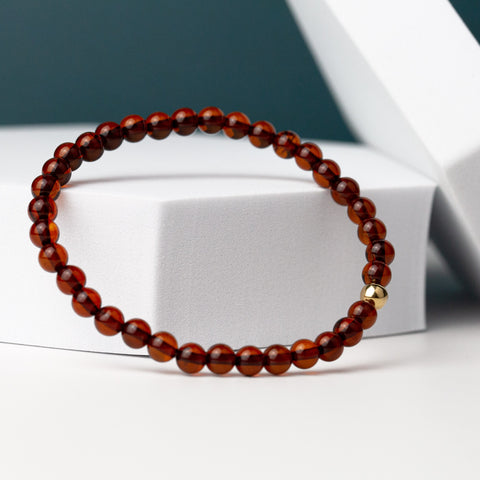 Amber bracelet with 18K solid gold bead