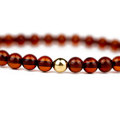 Amber bracelet with 18K solid gold bead